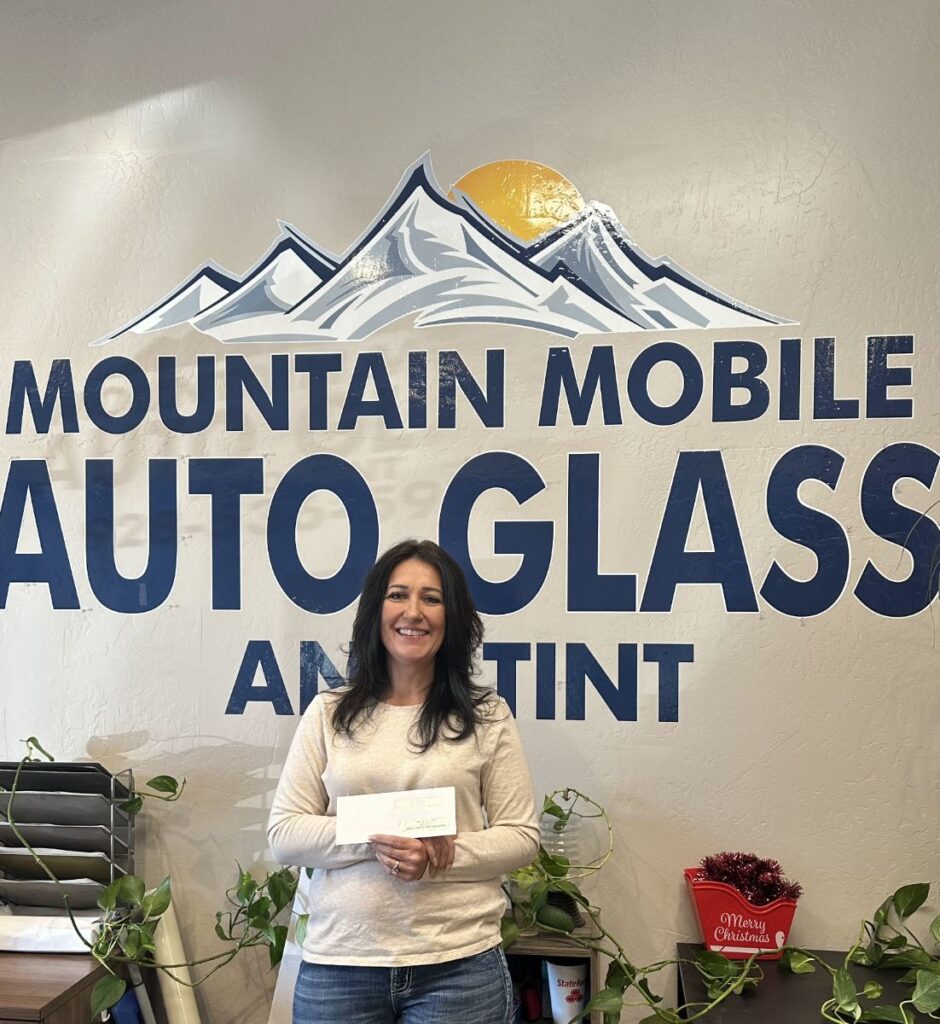 Lady posing with $500 check