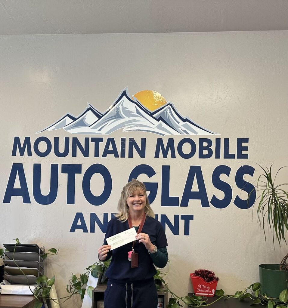 Gayle Adams Lady who won $250 and a Las Vegas trip posing with check